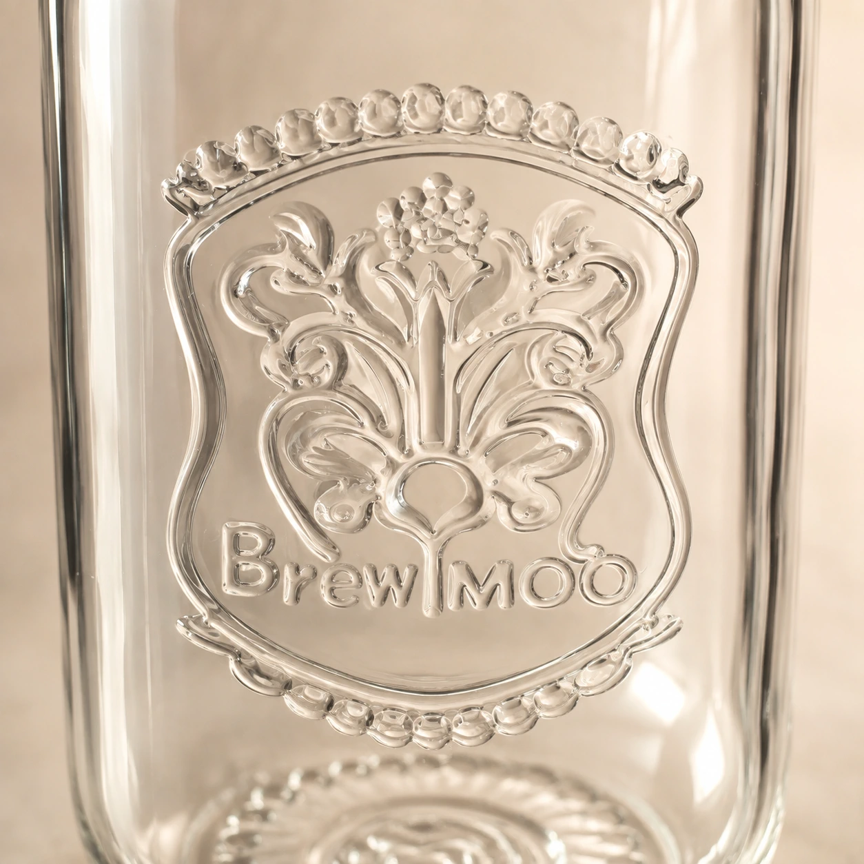 Close-up of embossed BrewMOO glass detail